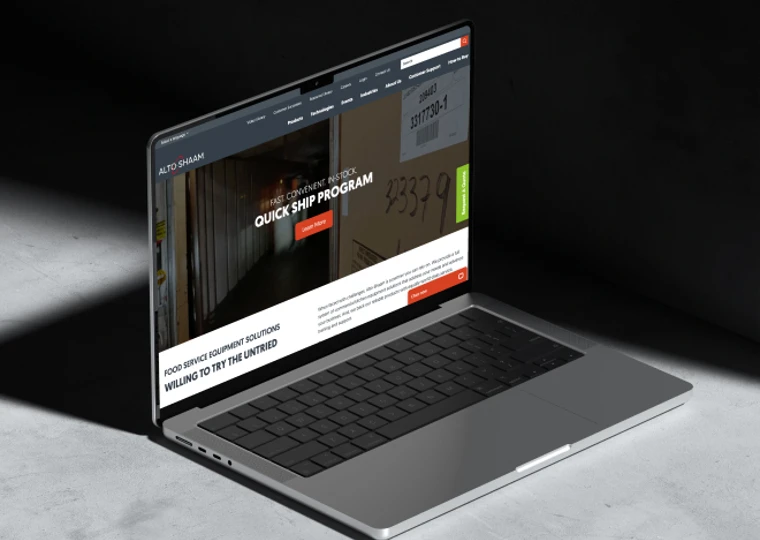 A laptop with the Alto-Shaam website showing on its screen.