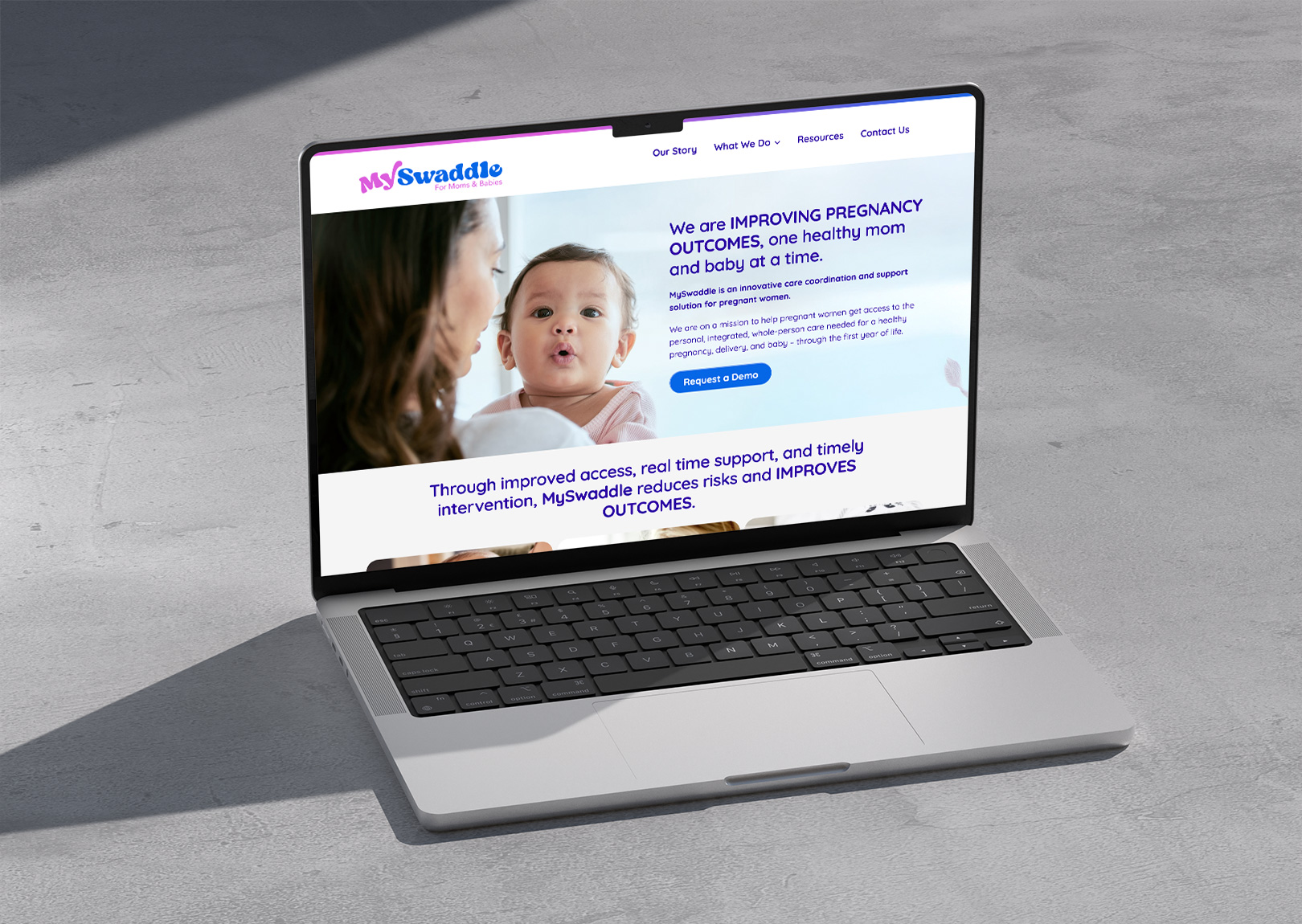 Photo of mySwaddle homepage shown on a laptop 
